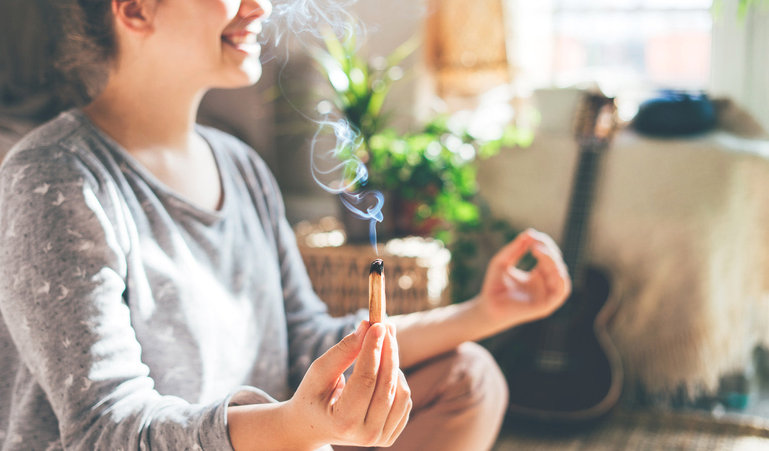 Woman Burning Palo Santo While Meditating at Home